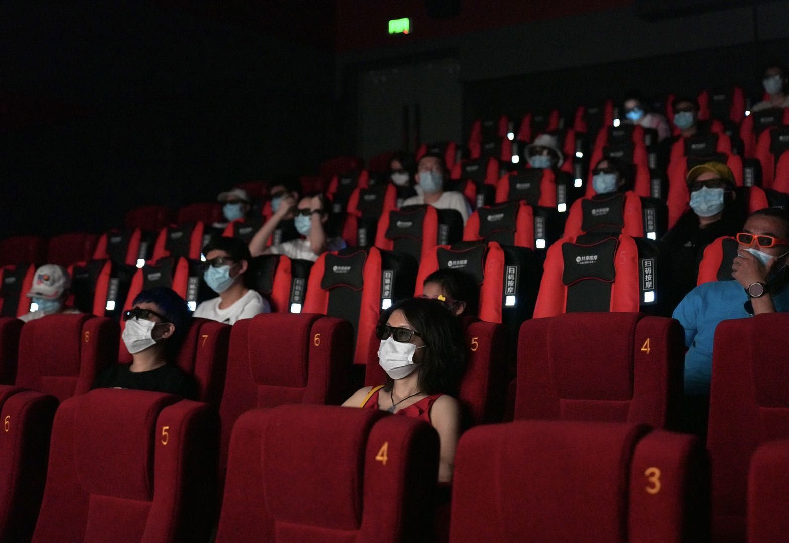 Cinemagoers wearing masks