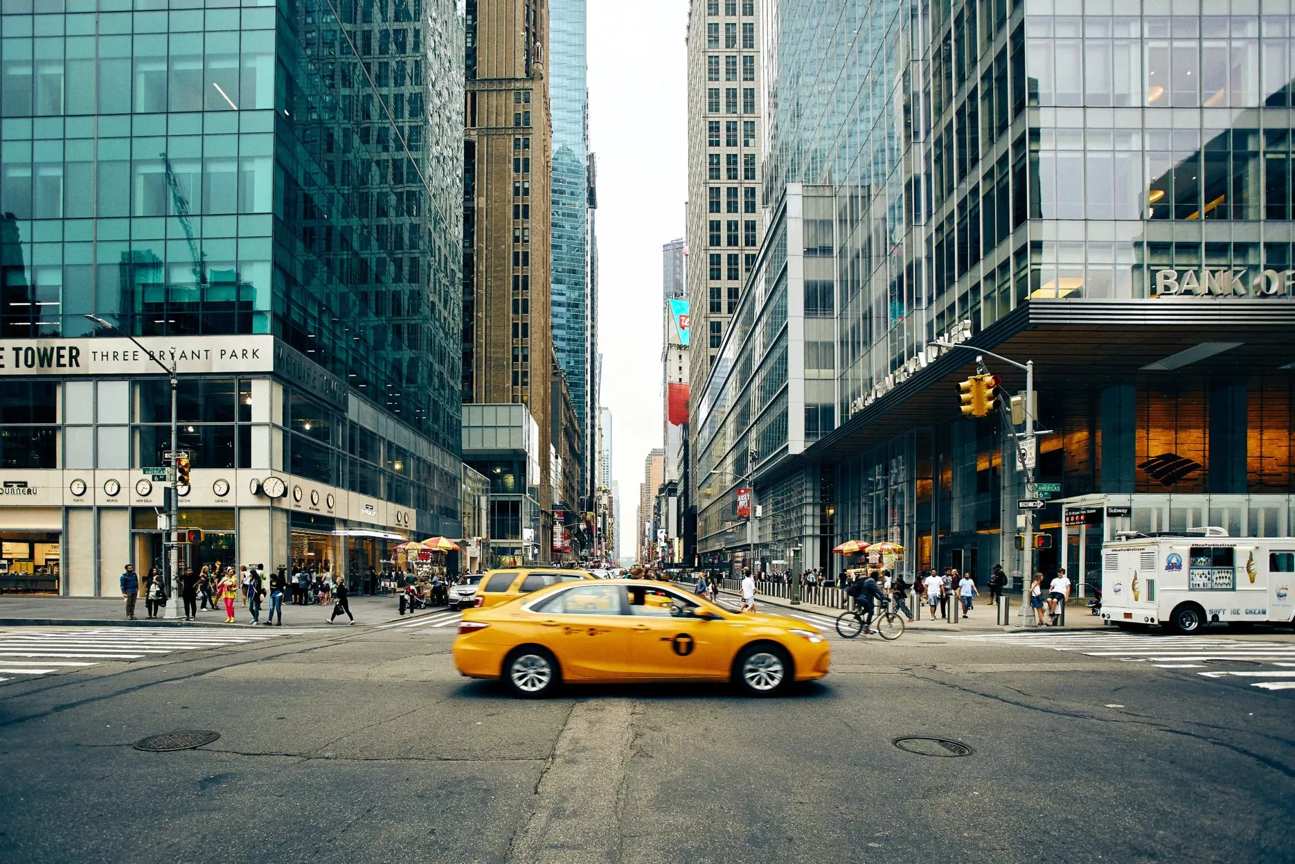 Yellow taxi at crossroads