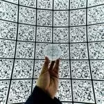 A globe in front of QR code background