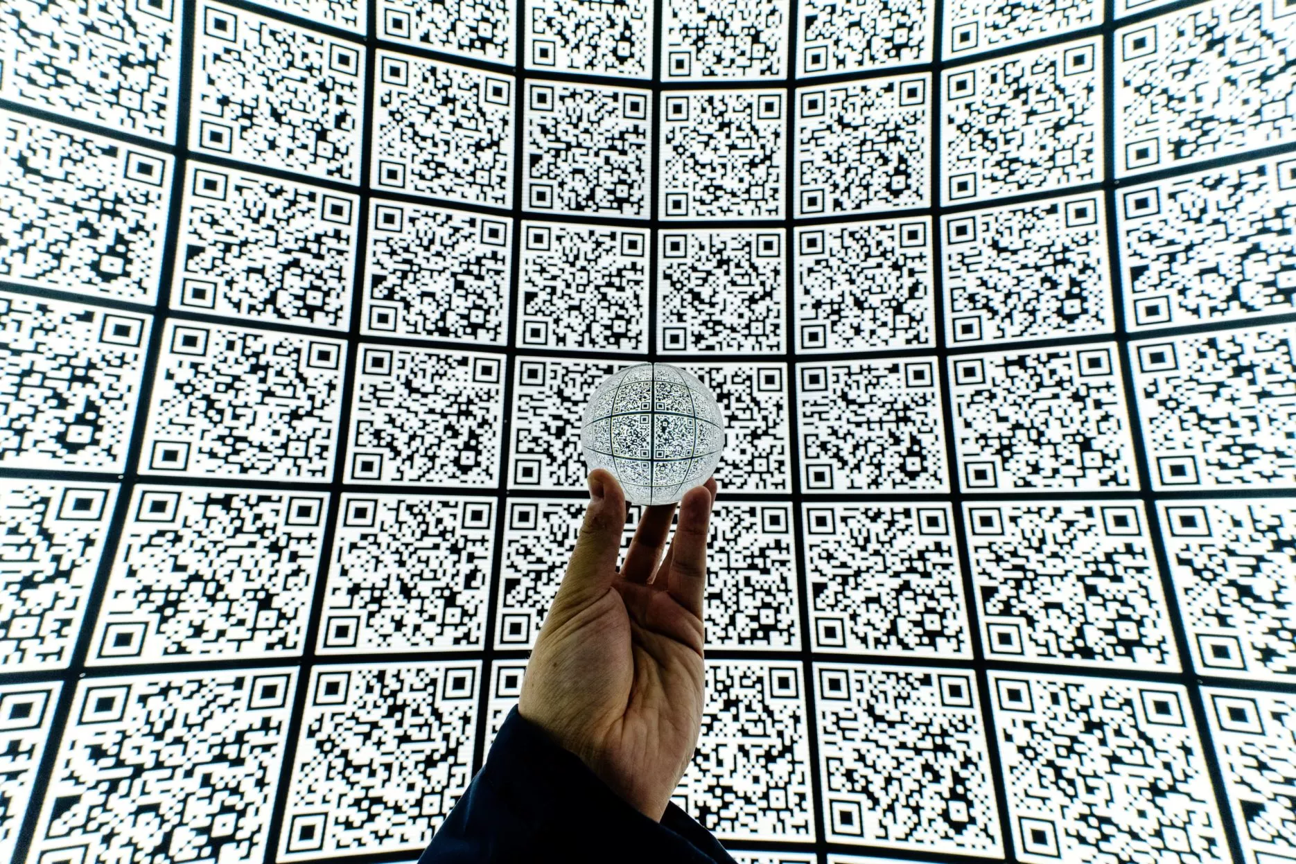 A globe in front of QR code background