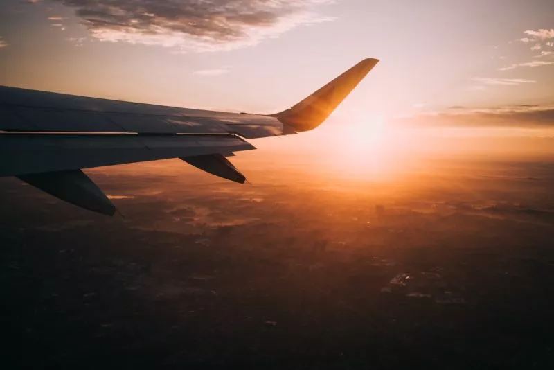 Airplane wing at sunset