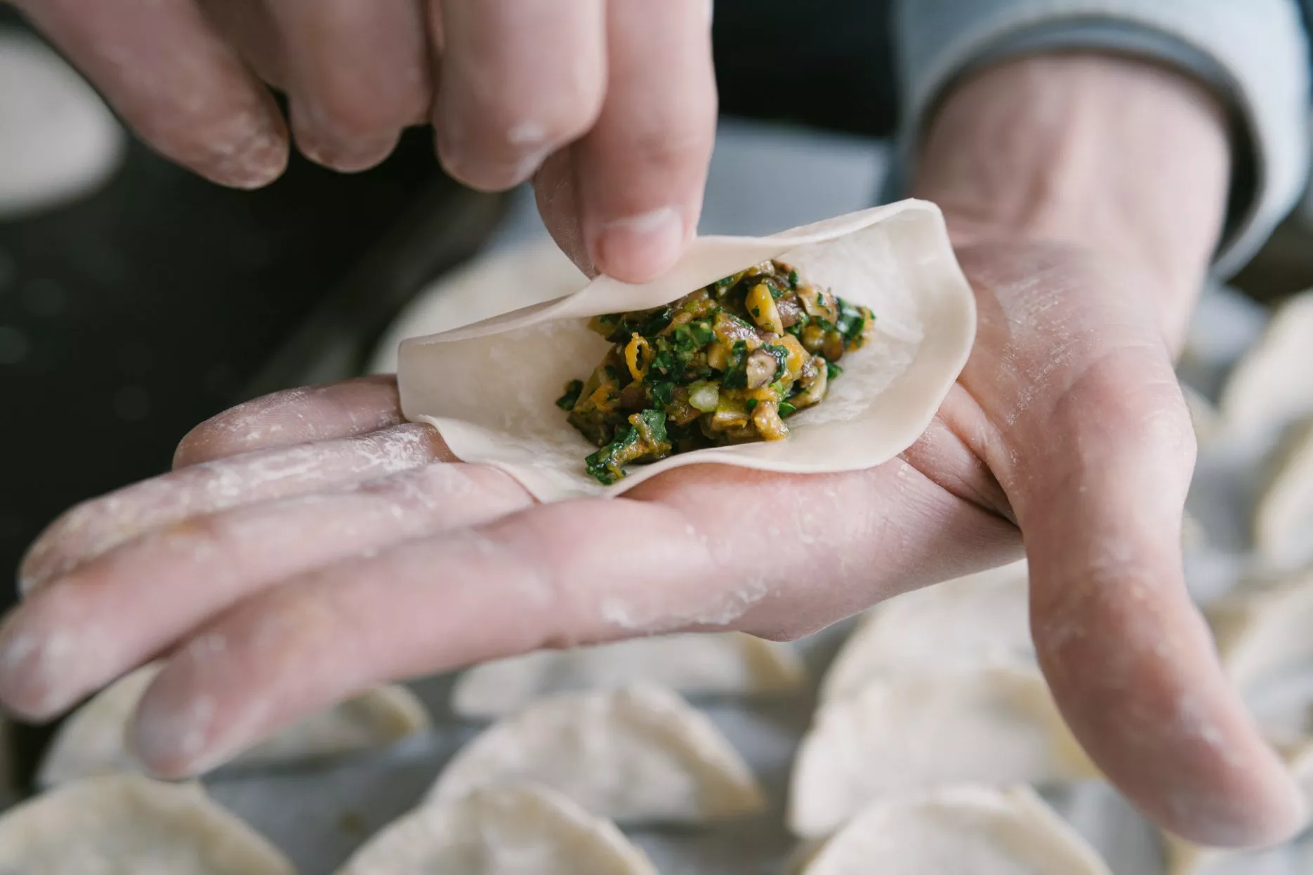 Wrapping dumplings in China