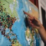 World map with pins in it