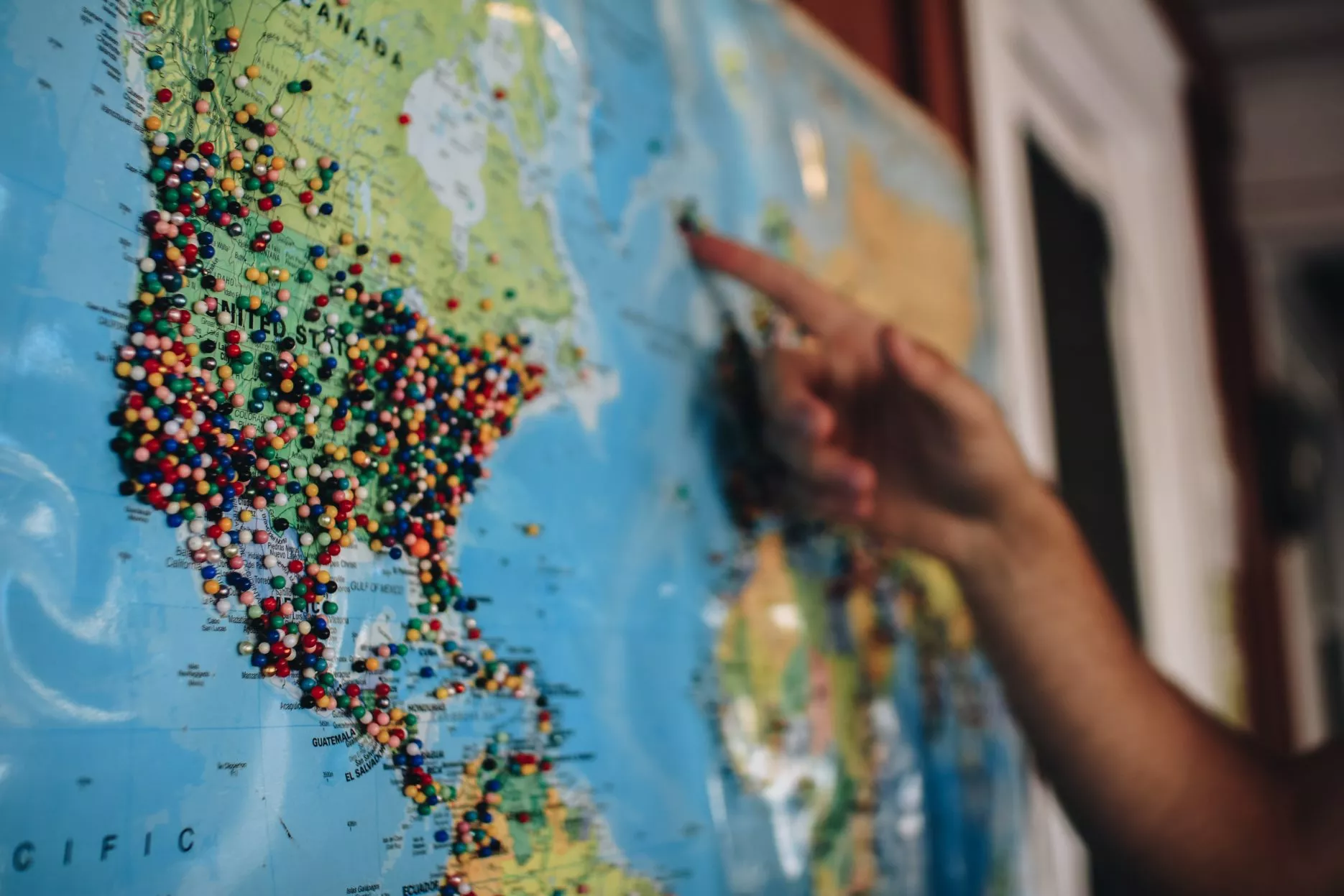 World map with pins in it
