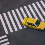 Taxi at crossroads. Credit: Unsplash