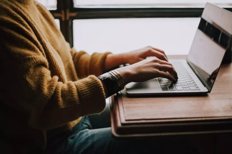 Working at laptop. Credit: Unsplash
