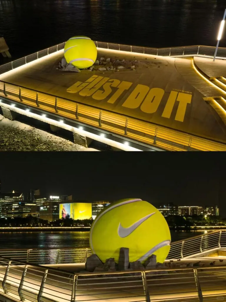 Nike tennis ball instalation at night